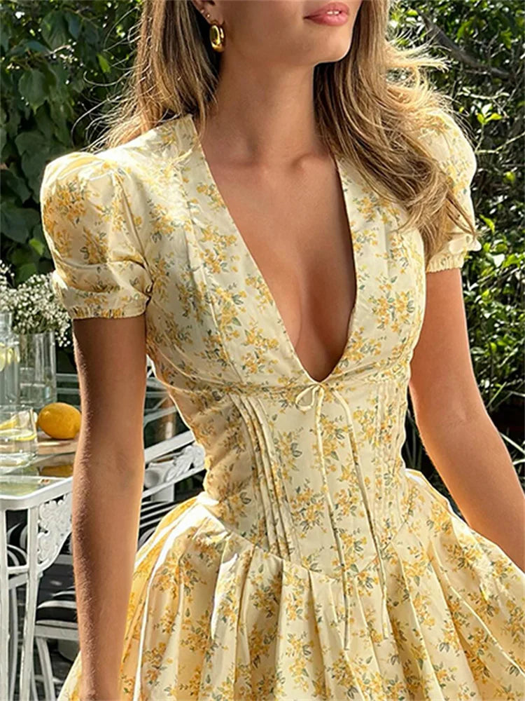Dress with floral pattern and plunging back