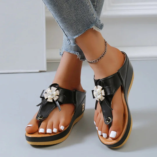 Women's sandals with low heel and metal decorations