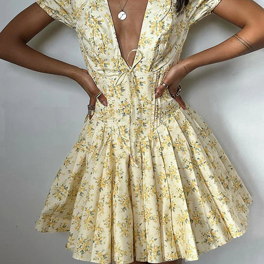 Dress with floral pattern and plunging back