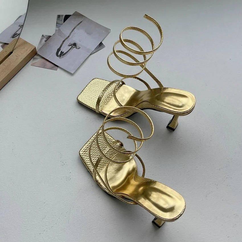 Luxurious women's sandals with heel and gold straps