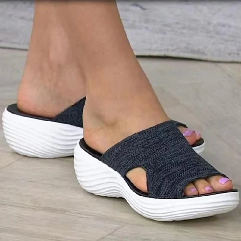 Women's orthopedic sandals on a platform made of elastic material