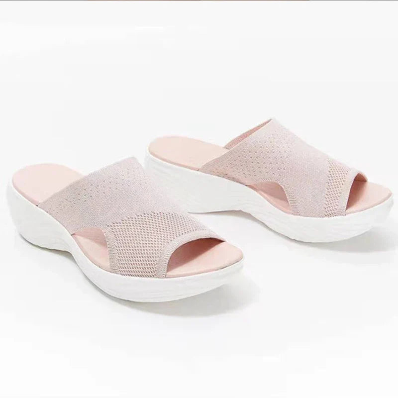 Women's orthopedic sandals on a platform made of elastic material