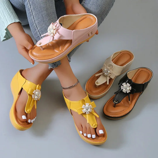 Women's sandals with low heel and metal decorations