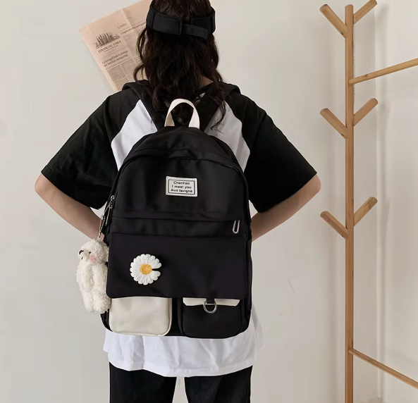 Spacious school backpack with floral application 