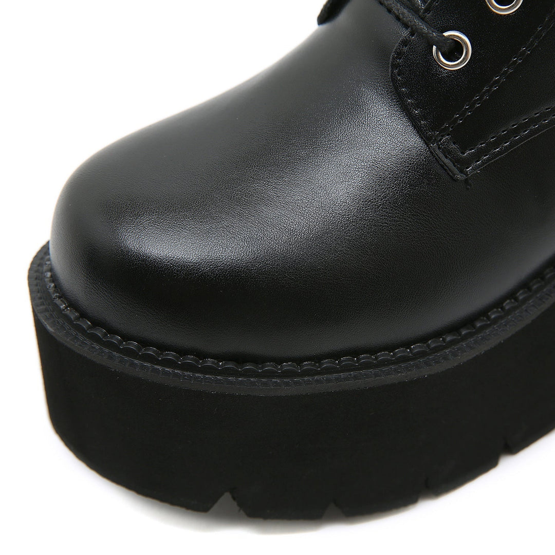 Black Martens-style high-heeled boots